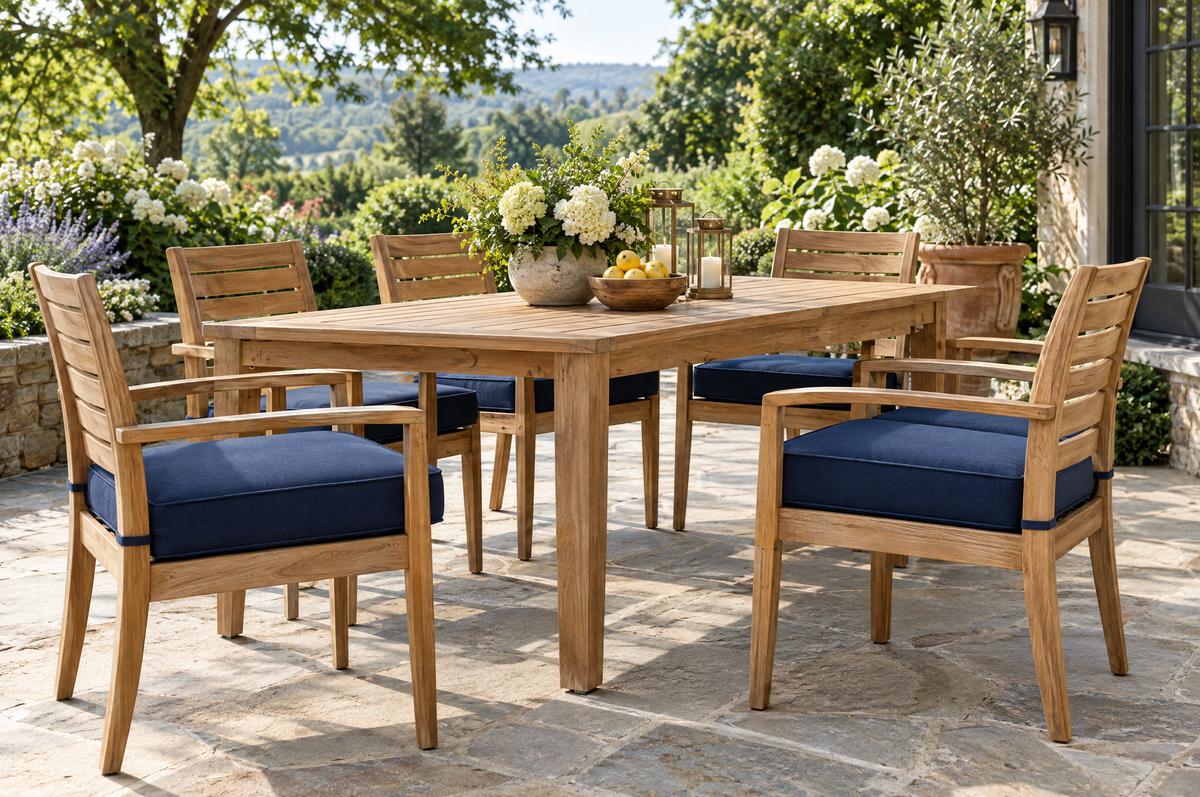 Teak patio dining chairs with navy outdoor seat cushions