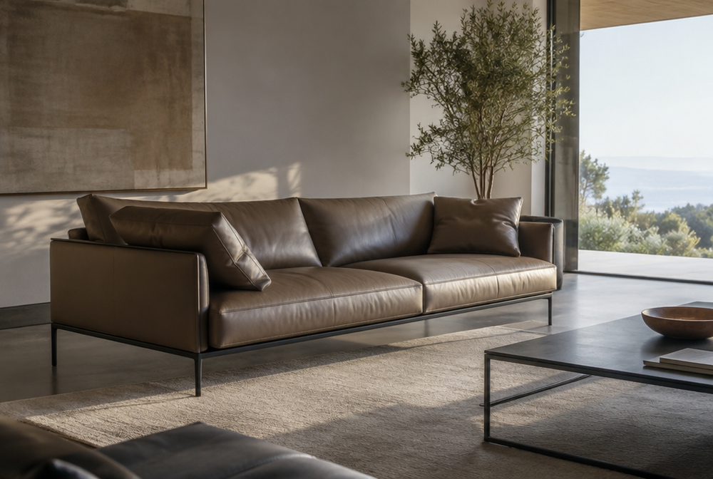 A modern living room with sleek leather cushions on a minimalist sofa
