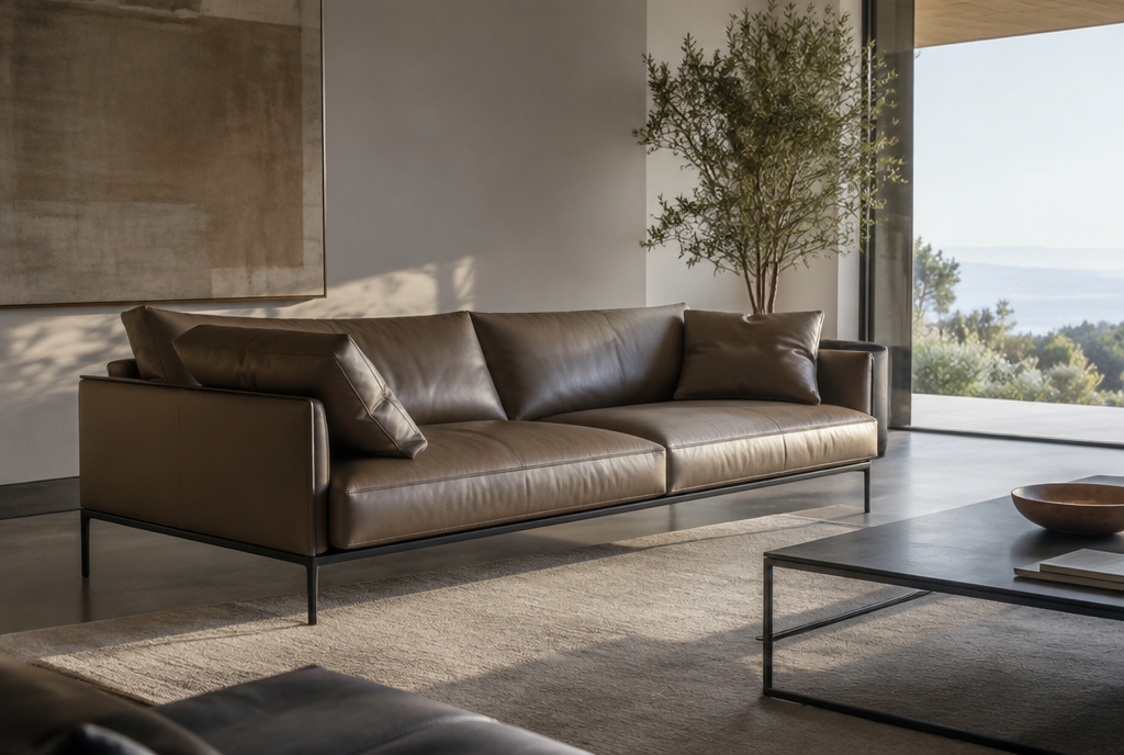 A modern living room with sleek leather cushions on a minimalist sofa