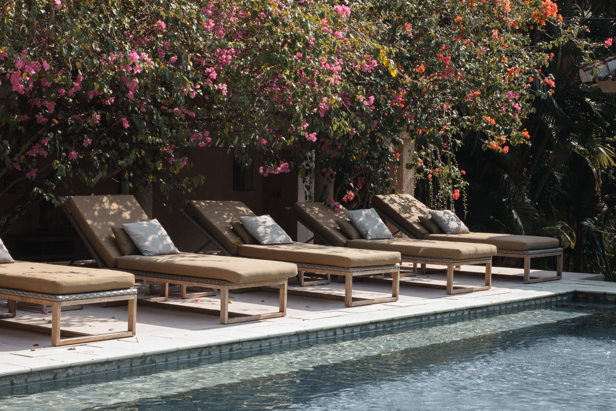 Poolside lounge chairs with outdoor cushions