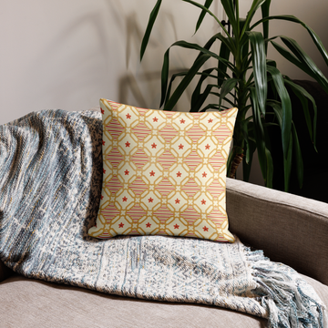 Nuture Harmony pillow, 18 x 18 in, cream lattice side in orange and green on a beige sofa with a knit throw