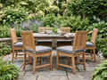 Replacement outdoor chair cushions in grey Sunbrella on teak patio dining chairs