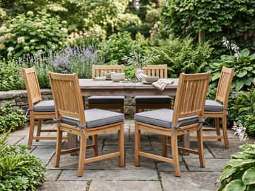 Replacement outdoor chair cushions in grey Sunbrella on teak patio dining chairs
