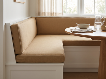 Custom L-shaped cushion on a corner banquette